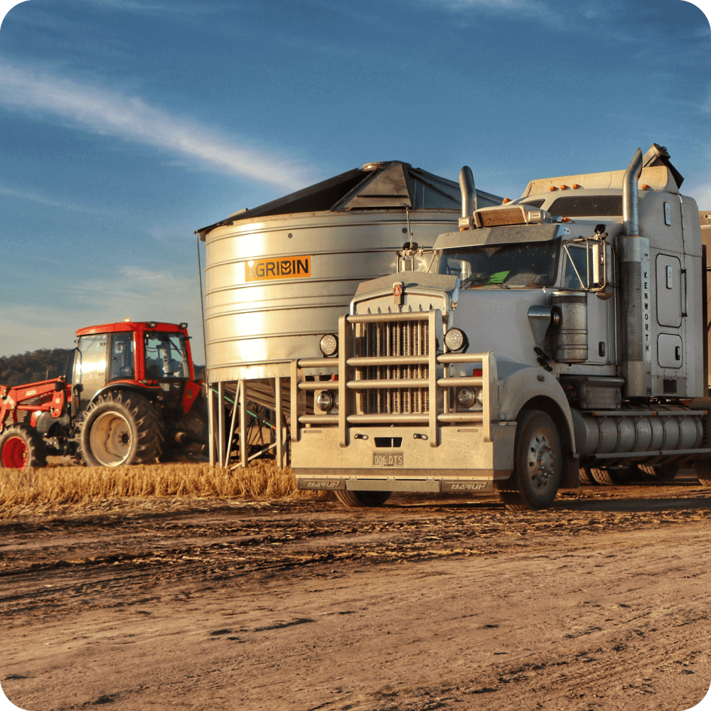 Agribin Road Train Bin in a stubble paddock beside a road train truck